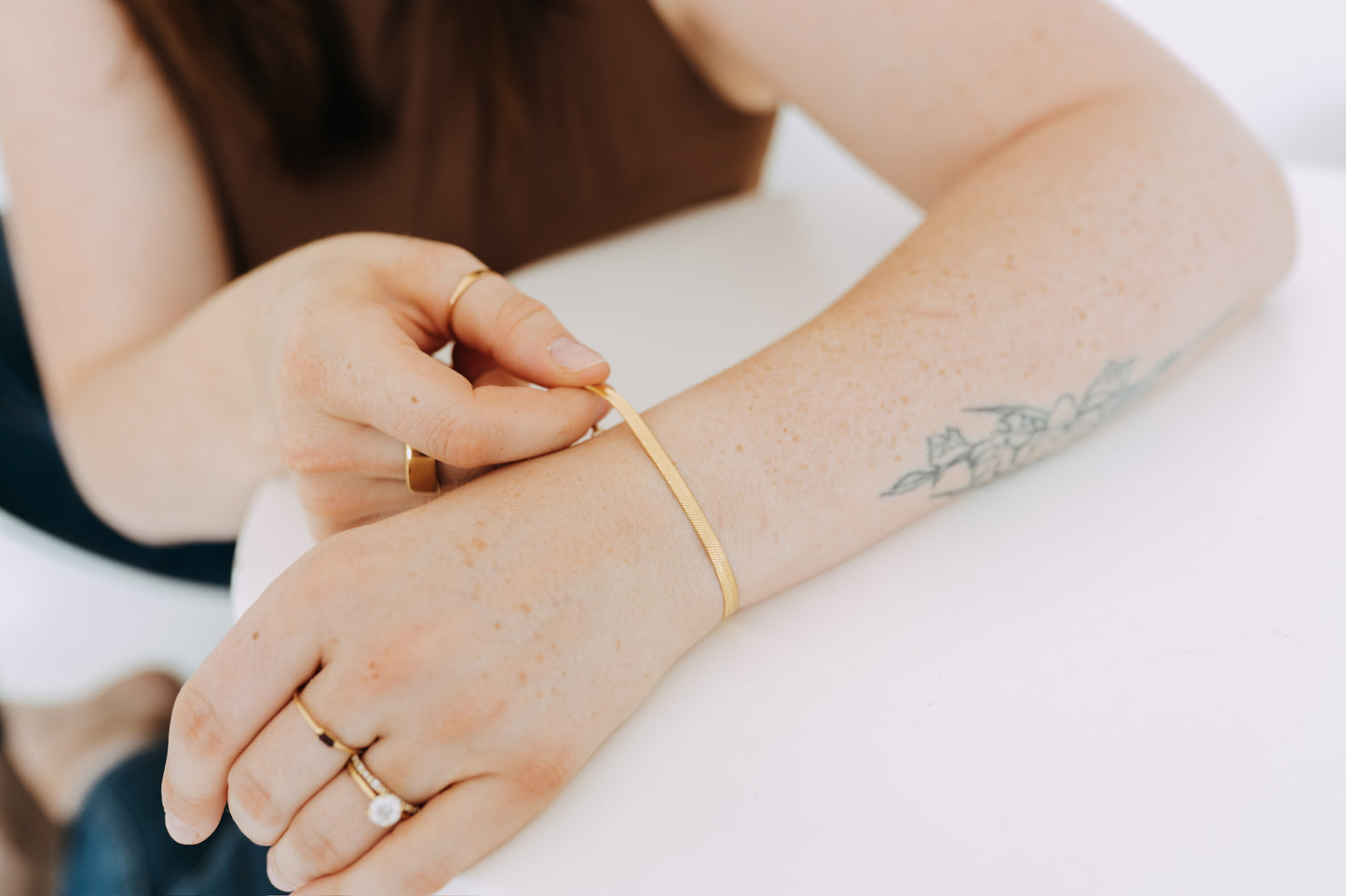 Close-up of polished herringbone bracelet on wrist