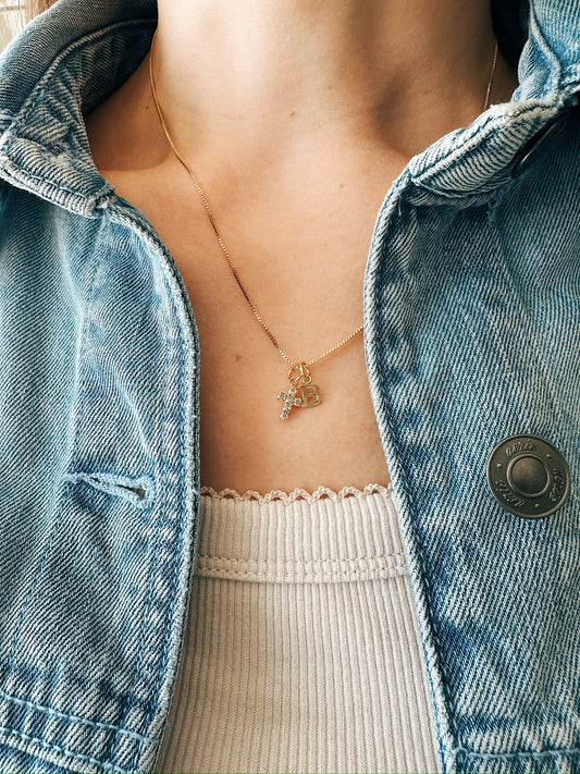 Gold filled faith necklace styled with denim jacket and personalized letter pendant