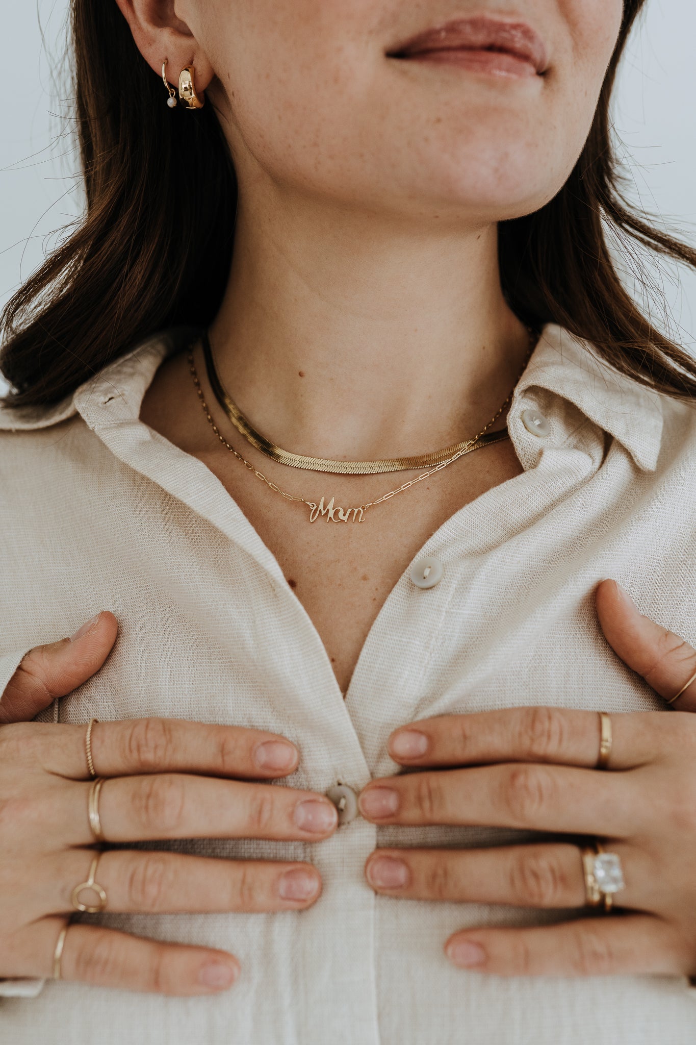 Delicate Mother's necklace crafted in 18k gold filled material with paperclip chain detail.