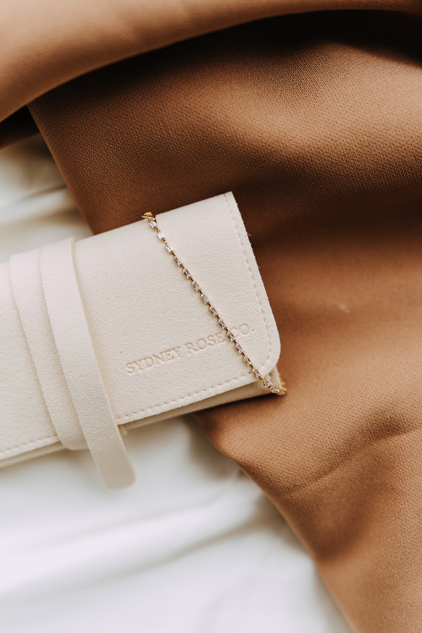 Close-up of gold filled baguette cubic zirconia tennis bracelet