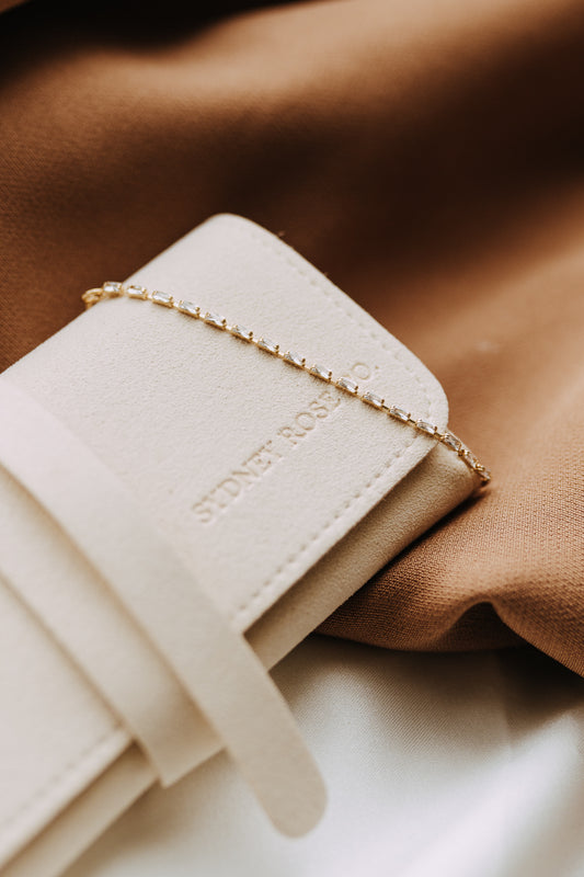 Baguette tennis bracelet in 18k gold filled on ivory jewelry roll