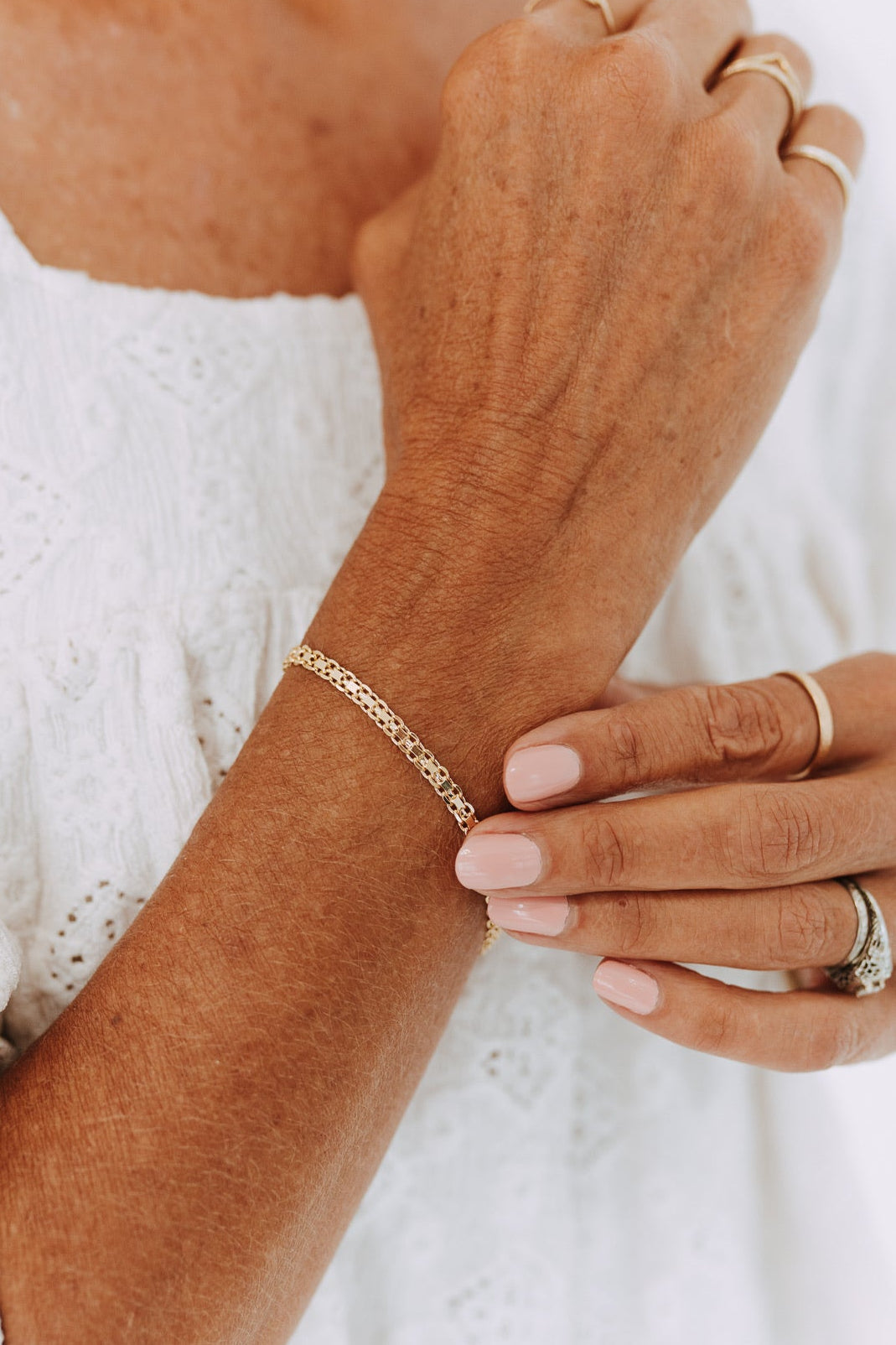 Marlow 18k gold filled double curb chain bracelet on model wrist