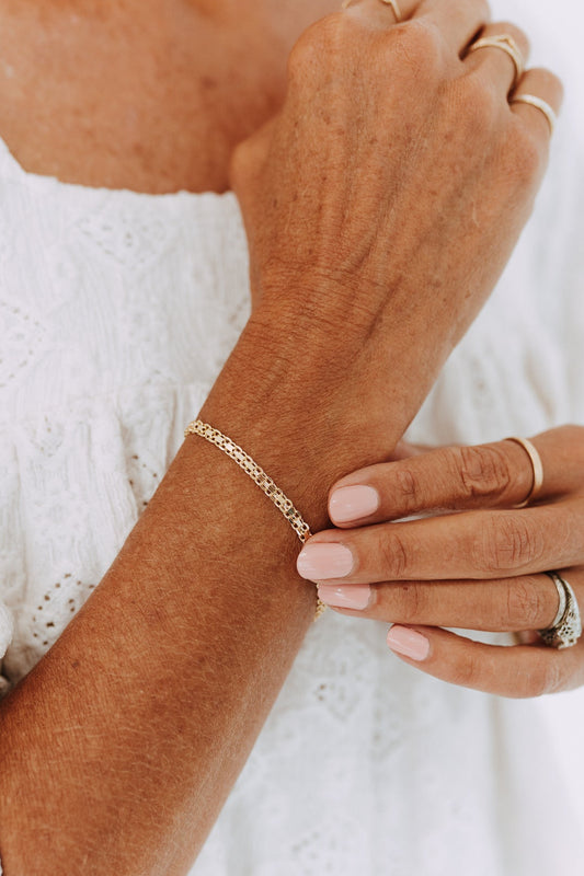 Marlow 18k gold filled double curb chain bracelet on model wrist