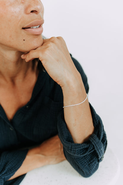 Minimalist sterling silver rope bracelet styled for everyday wear
