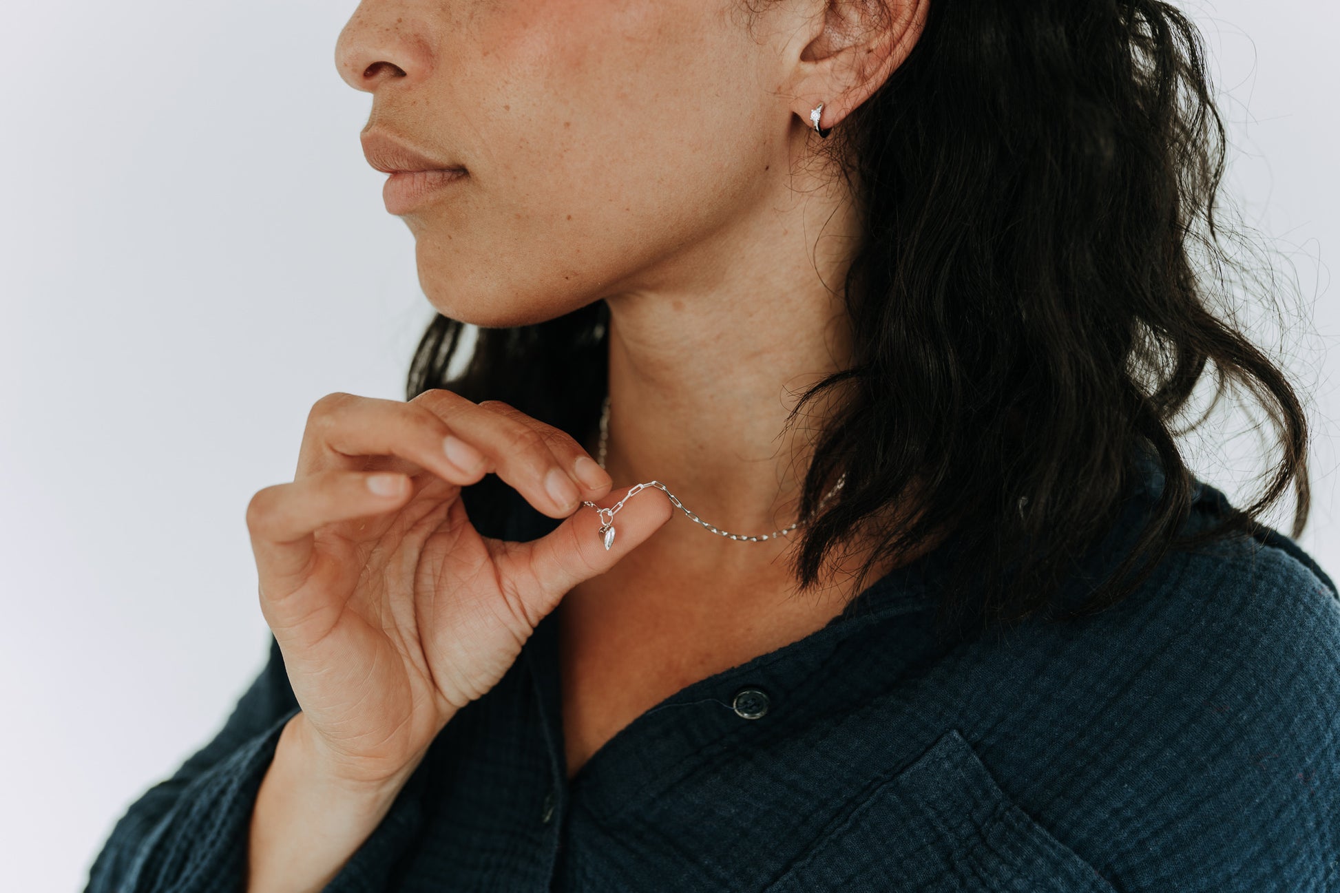 Minimalist sterling silver heart necklace designed for layering and everyday wear