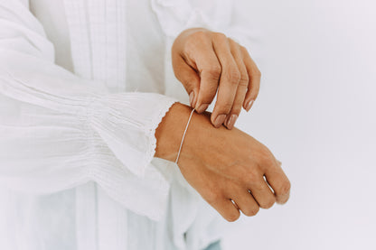 Adjustable Sterling Silver Shimmer Bracelet featuring a fine diamond-cut chain and polished finish.