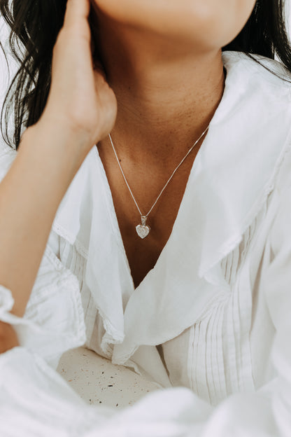 Classic 15mm sterling silver heart locket pendant on a fine box chain.
Everyday sterling silver heart locket necklace with engraved front design.