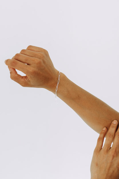 Sterling silver bold paperclip bracelet with elongated links on model wrist