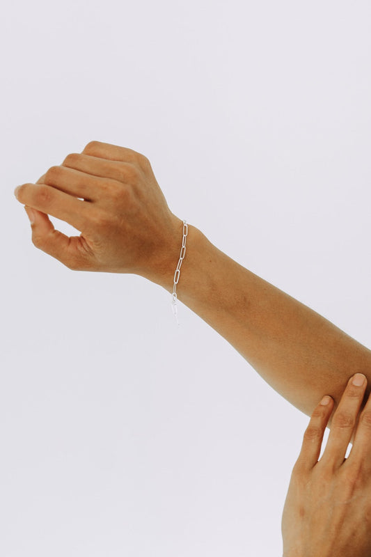 Sterling silver bold paperclip bracelet with elongated links on model wrist