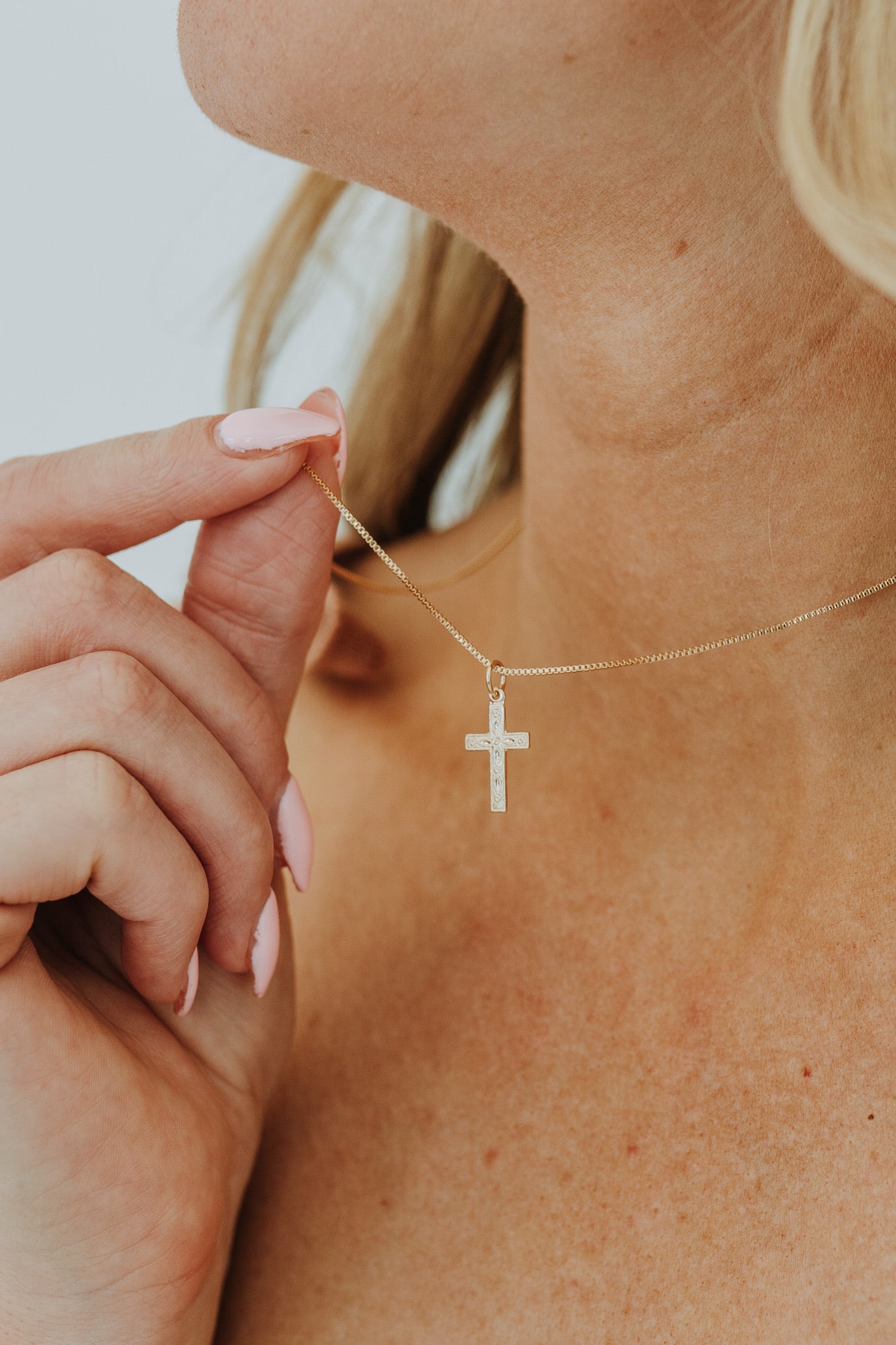 Tarnish resistant gold cross necklace close-up