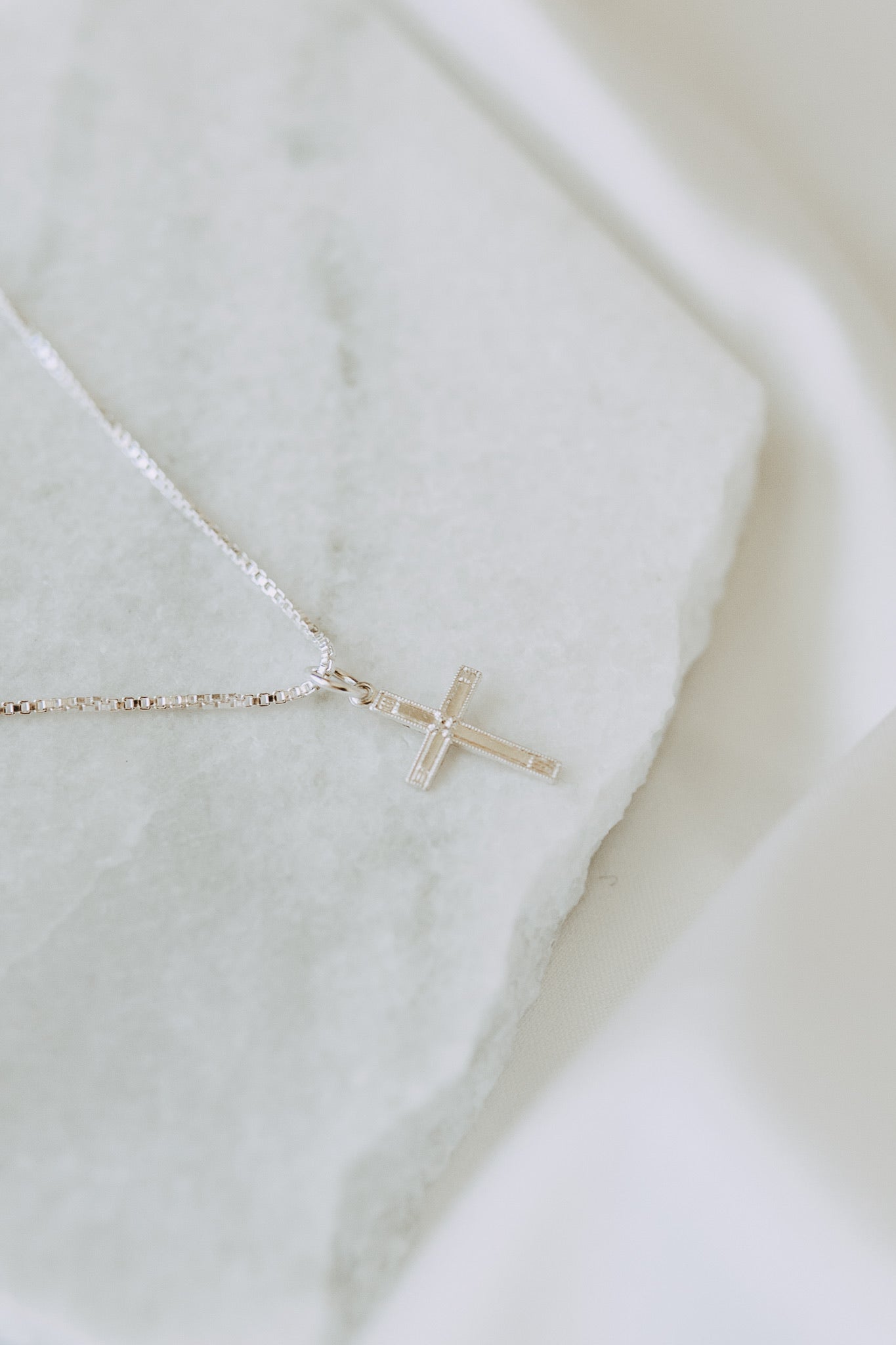 Elegant sterling silver cross necklace for layering