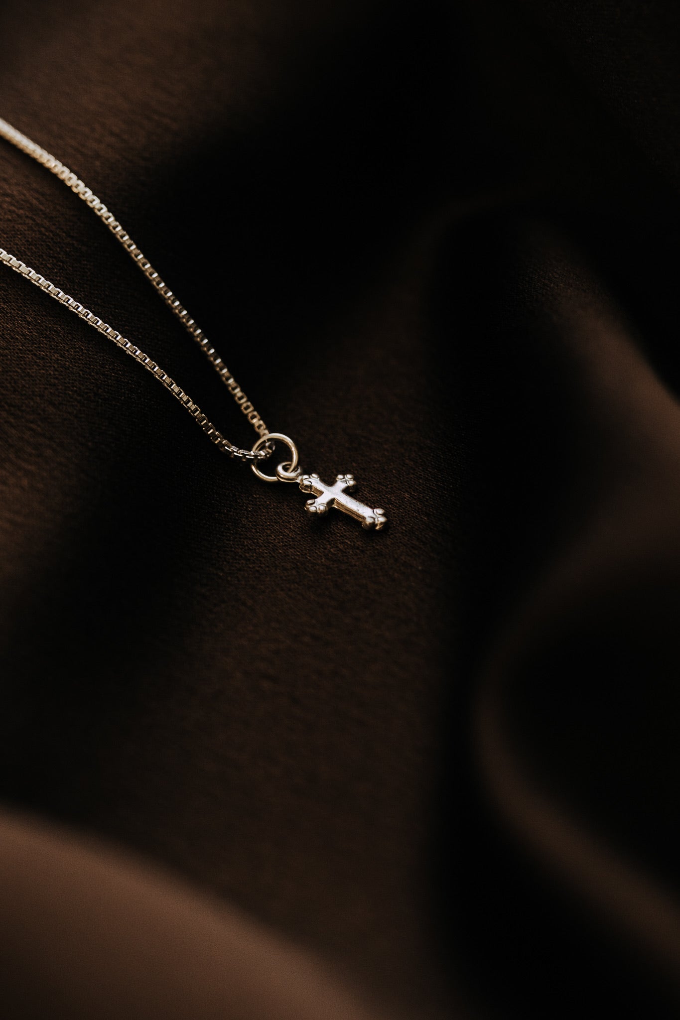 Lightweight sterling silver cross necklace close-up