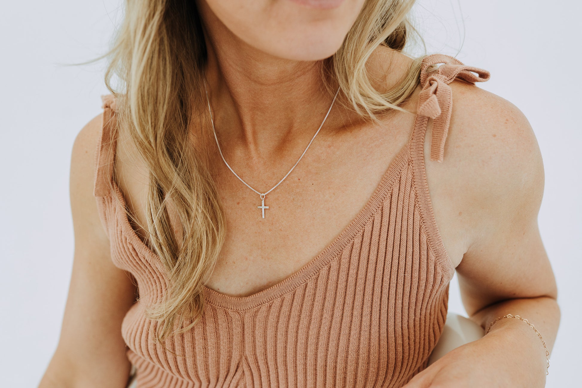 Lightweight silver cross necklace with minimalist styling