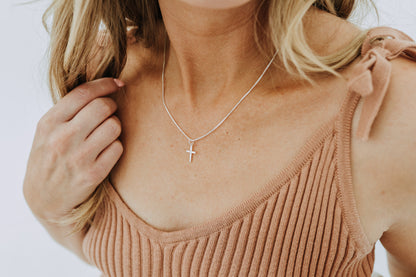 Lightweight silver cross necklace with minimalist styling