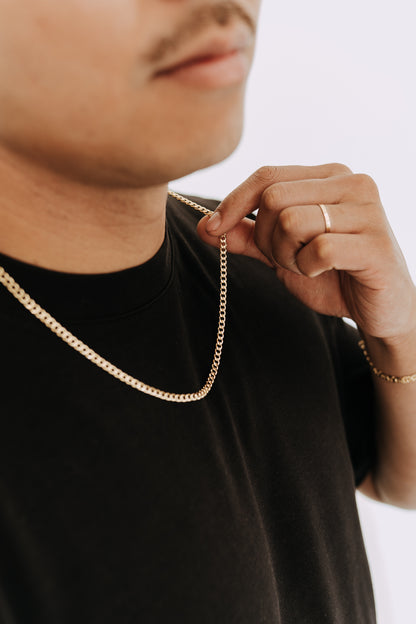 Close-up of 18k gold filled curb chain necklace for men with polished shine