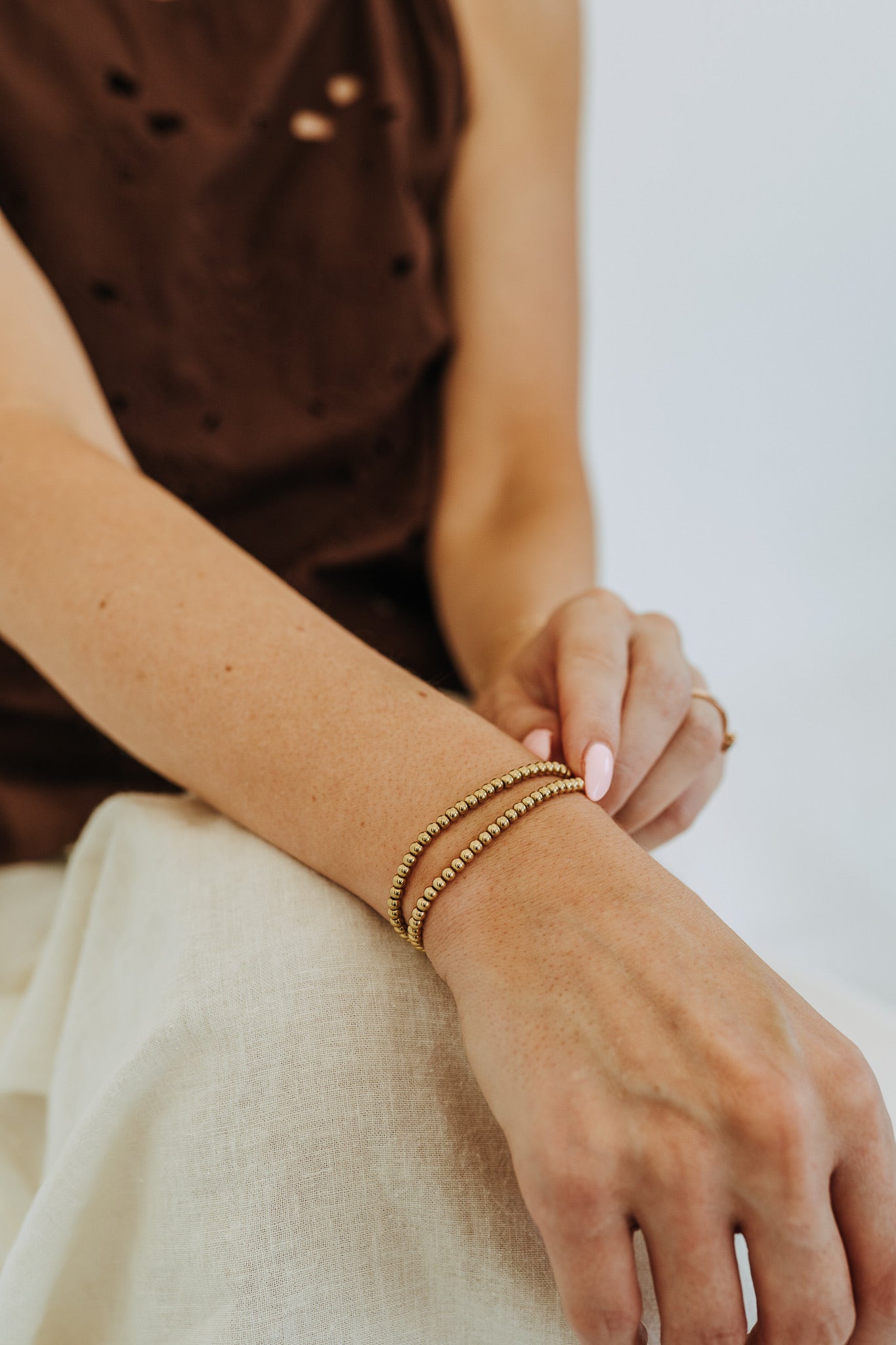Lightweight 4mm gold bead bracelet with chic layered bracelet styling