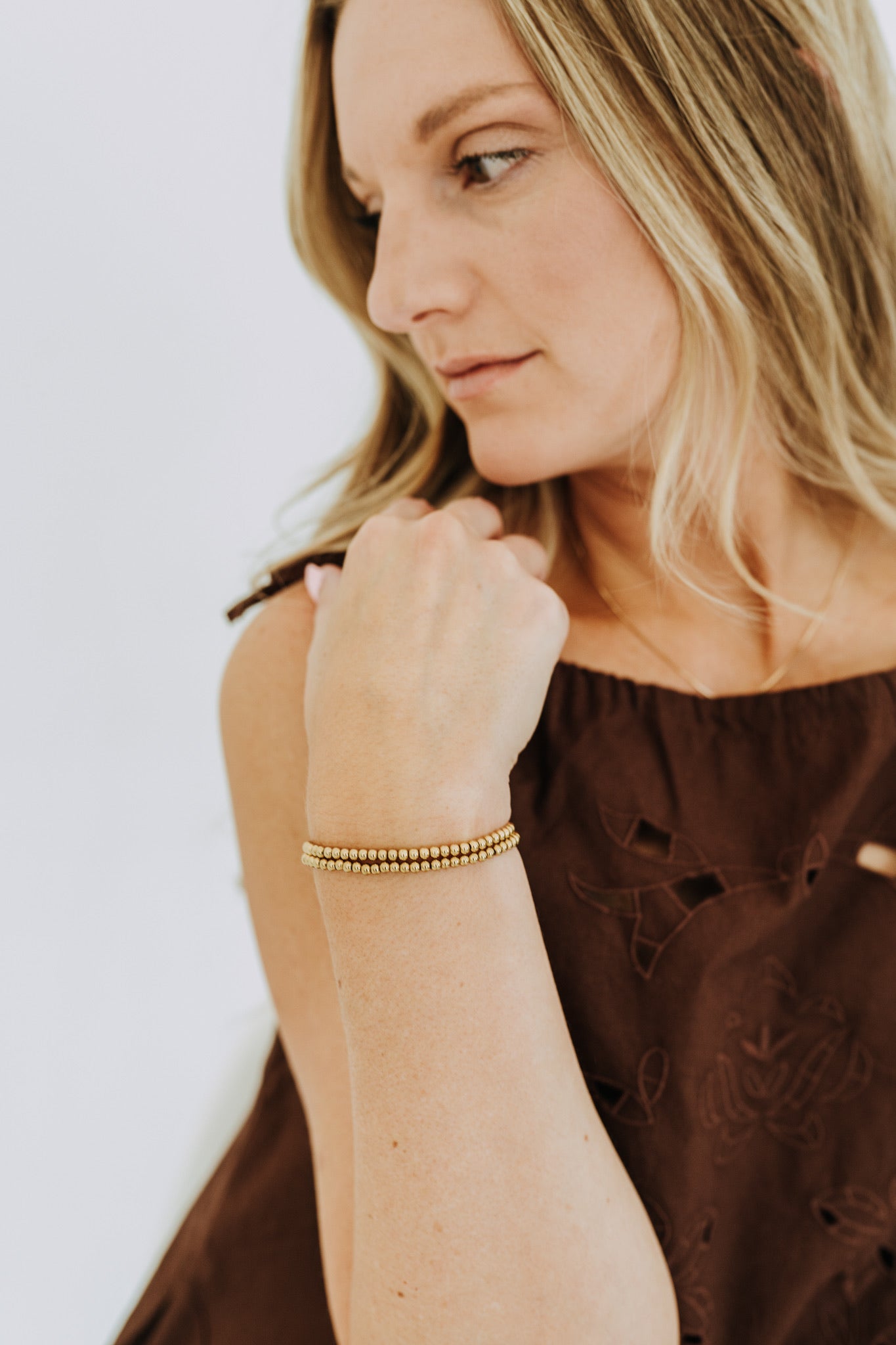 Waterproof gold bead bracelet styled casually for everyday jewelry looks