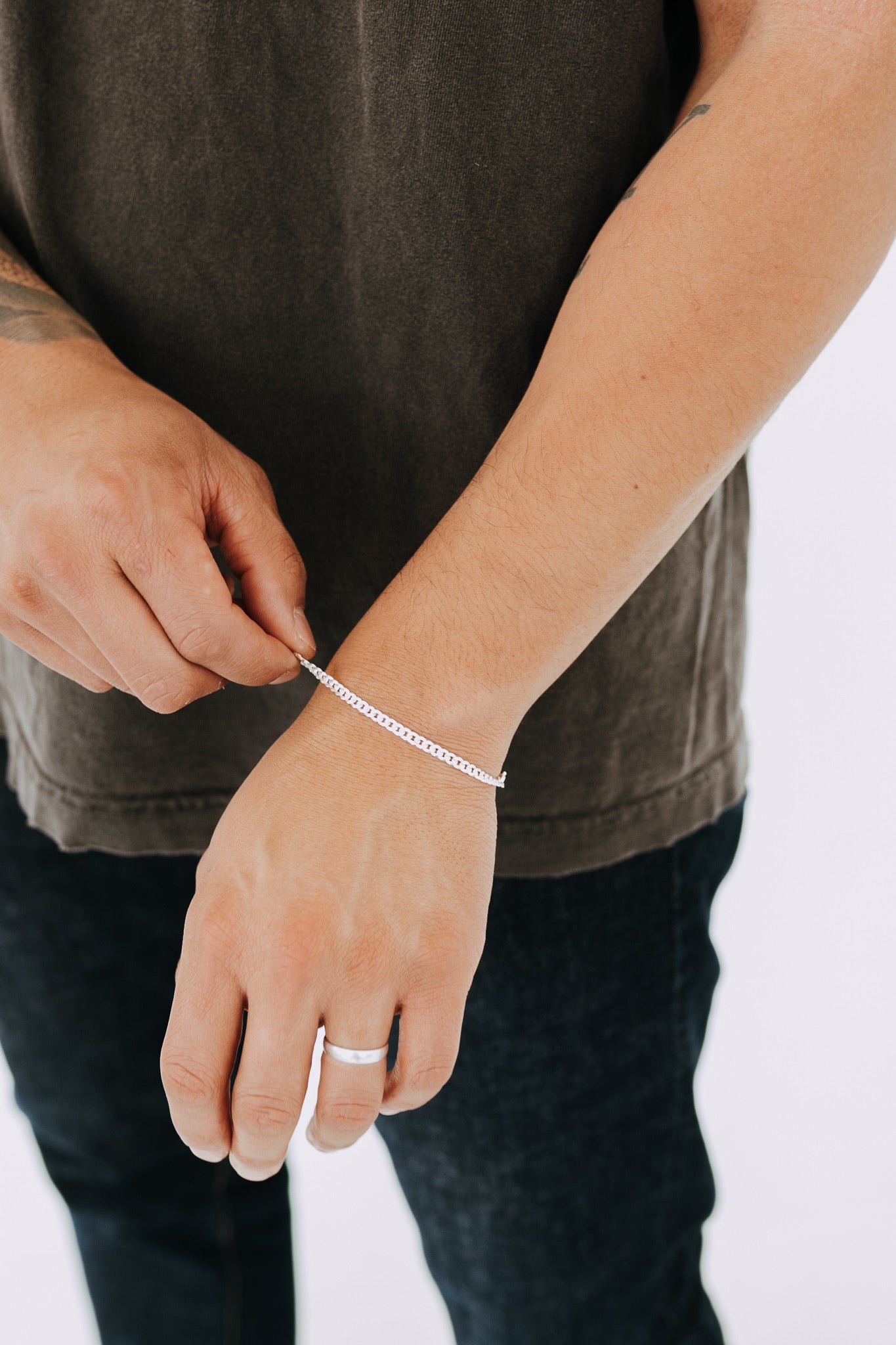 Classic sterling silver curb chain bracelet styled on male wrist