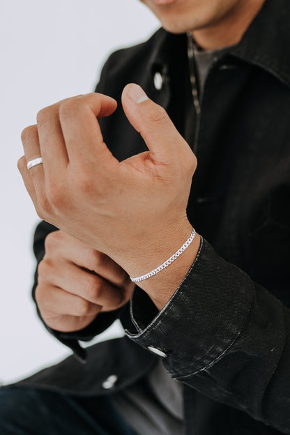 Close-up of 4mm sterling silver curb bracelet on wrist