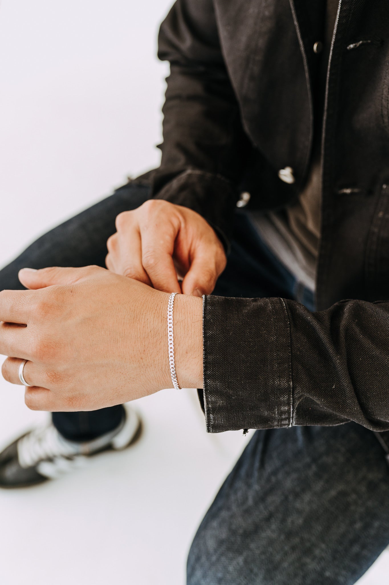 Classic sterling silver curb chain bracelet styled on male wrist