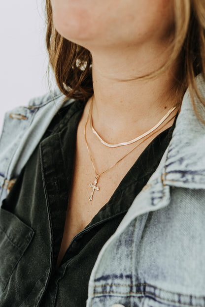 Waterproof gold cross necklace designed for everyday wear
