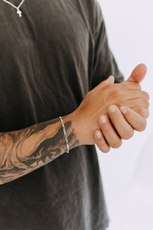 Solid sterling silver Figaro bracelet styled with casual men's outfit