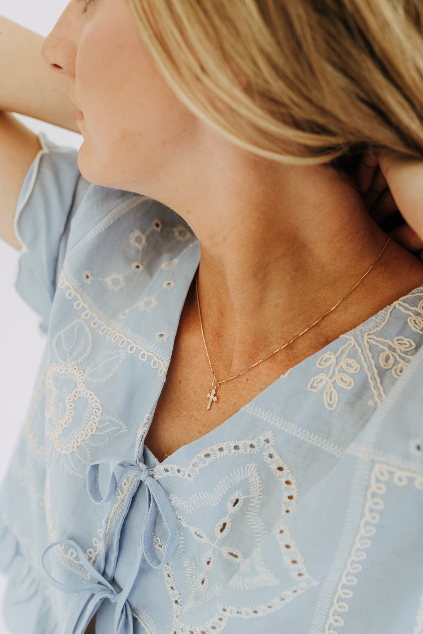 gold necklaces featuring vintage-inspired cross charm