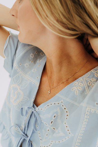 gold necklaces featuring vintage-inspired cross charm