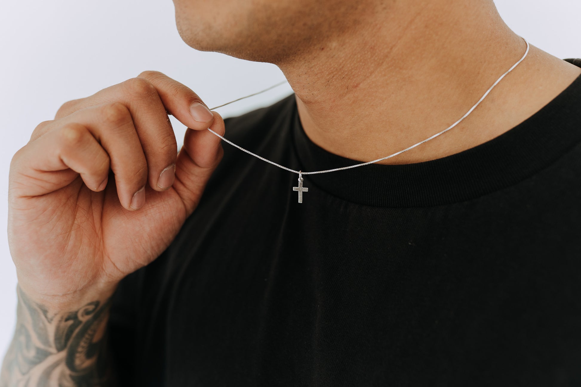 Men’s sterling silver minimal cross necklace on fine silver chain