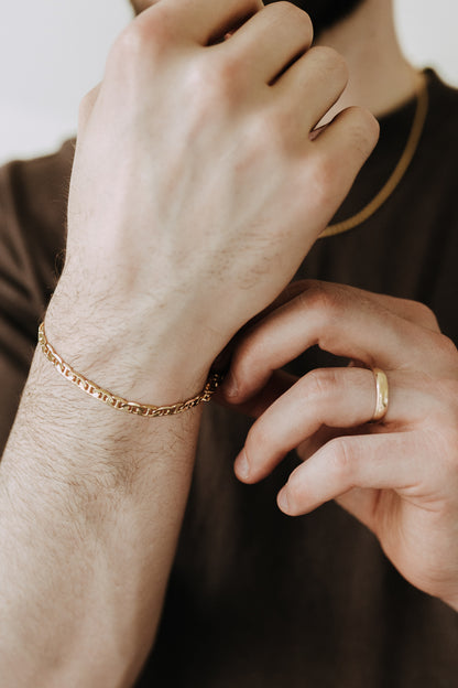 Close-up of men’s gold Roma bracelet featuring bold geometric links and modern everyday styling